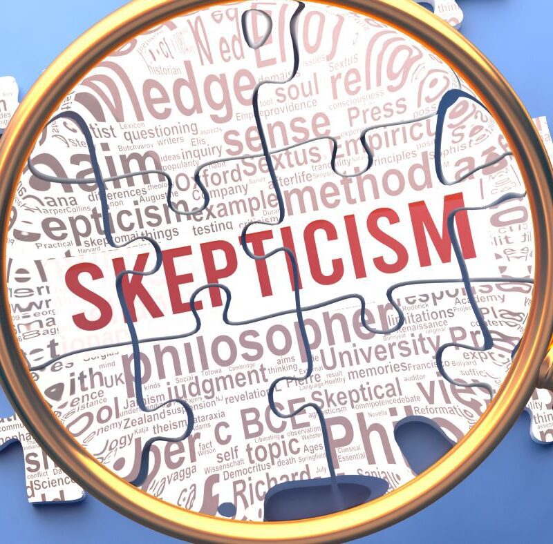 A magnifying glass illuminating the word "skepticism"