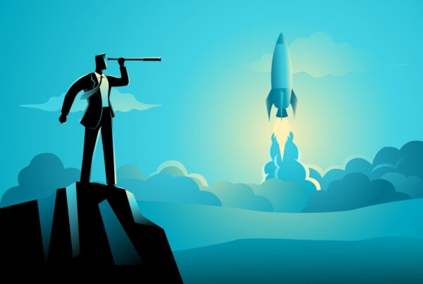Businessman looking at rocket launch through a telescope